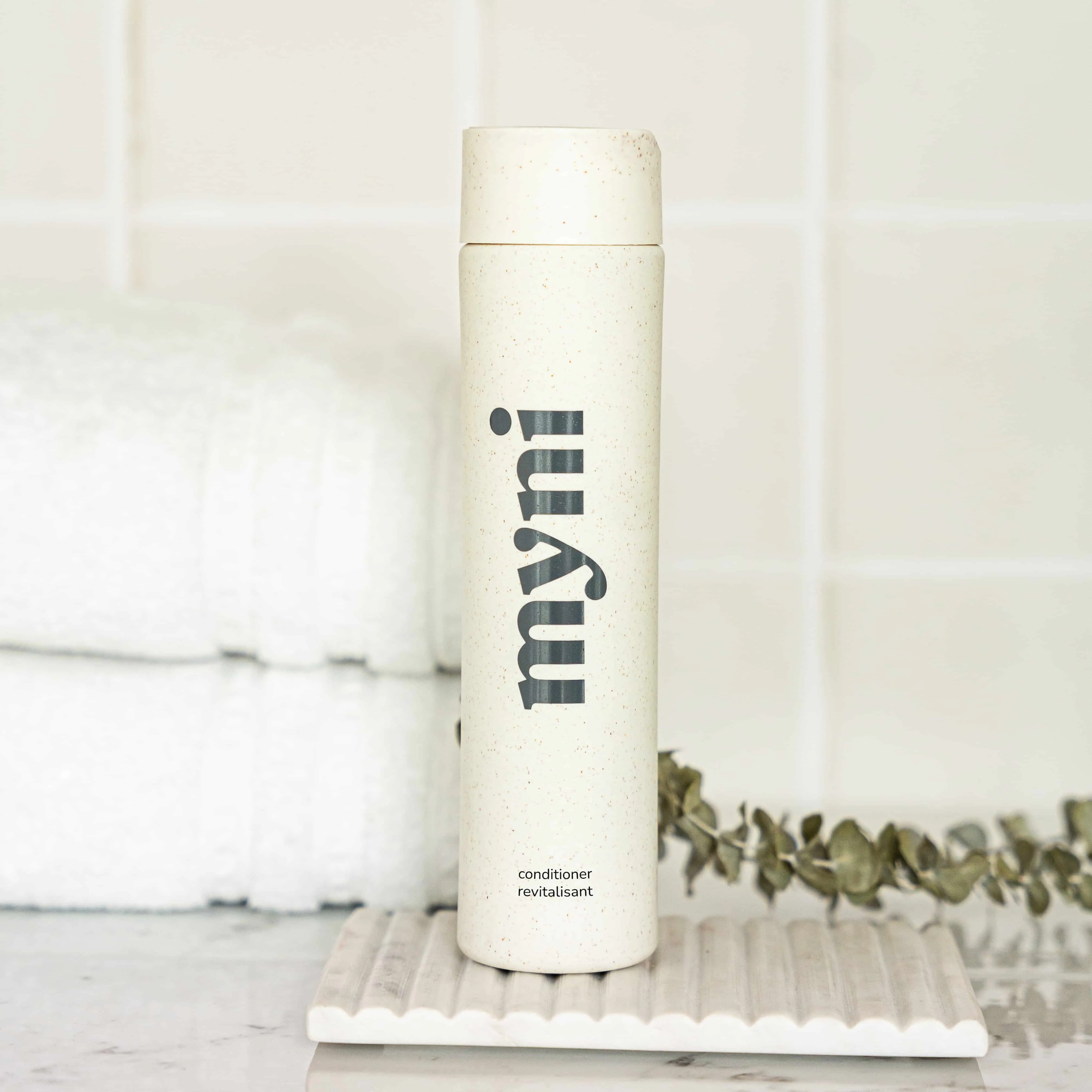 Conditioner bottle in wheat straw