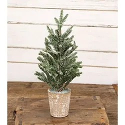 Frosted artificial wintry pine tree in pot