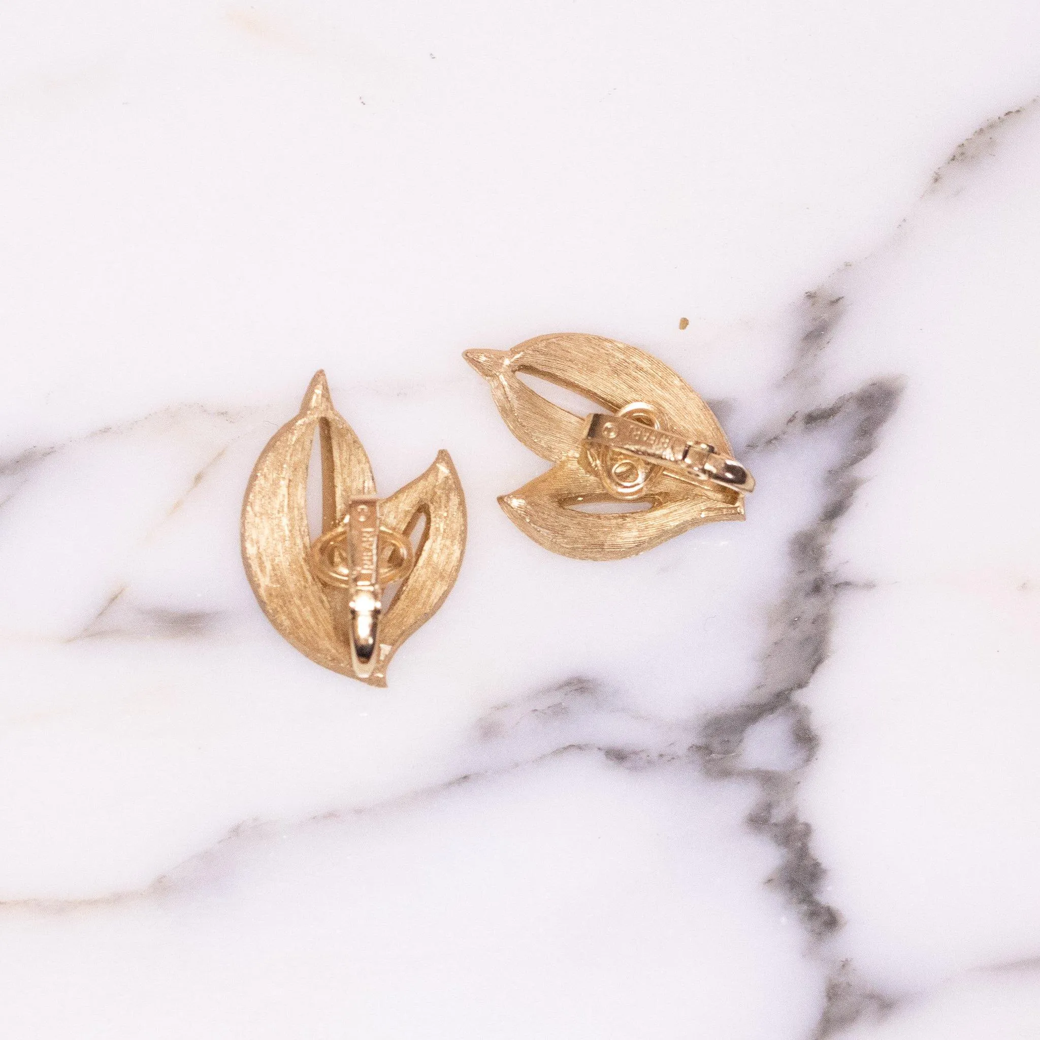 Vintage Crown Trifari Gold Tone White Enamel Leaf Earrings
